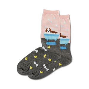 womens crew socks with dog print, pink and gray. cartoon dogs take a bath in a blue bathtub surrounded by rubber ducks, bubbles, and bones.   