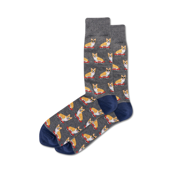 gray with blue toes and heels, these cotton blend crew socks feature a pattern of skateboarding corgis wearing sunglasses and red skateboards.  