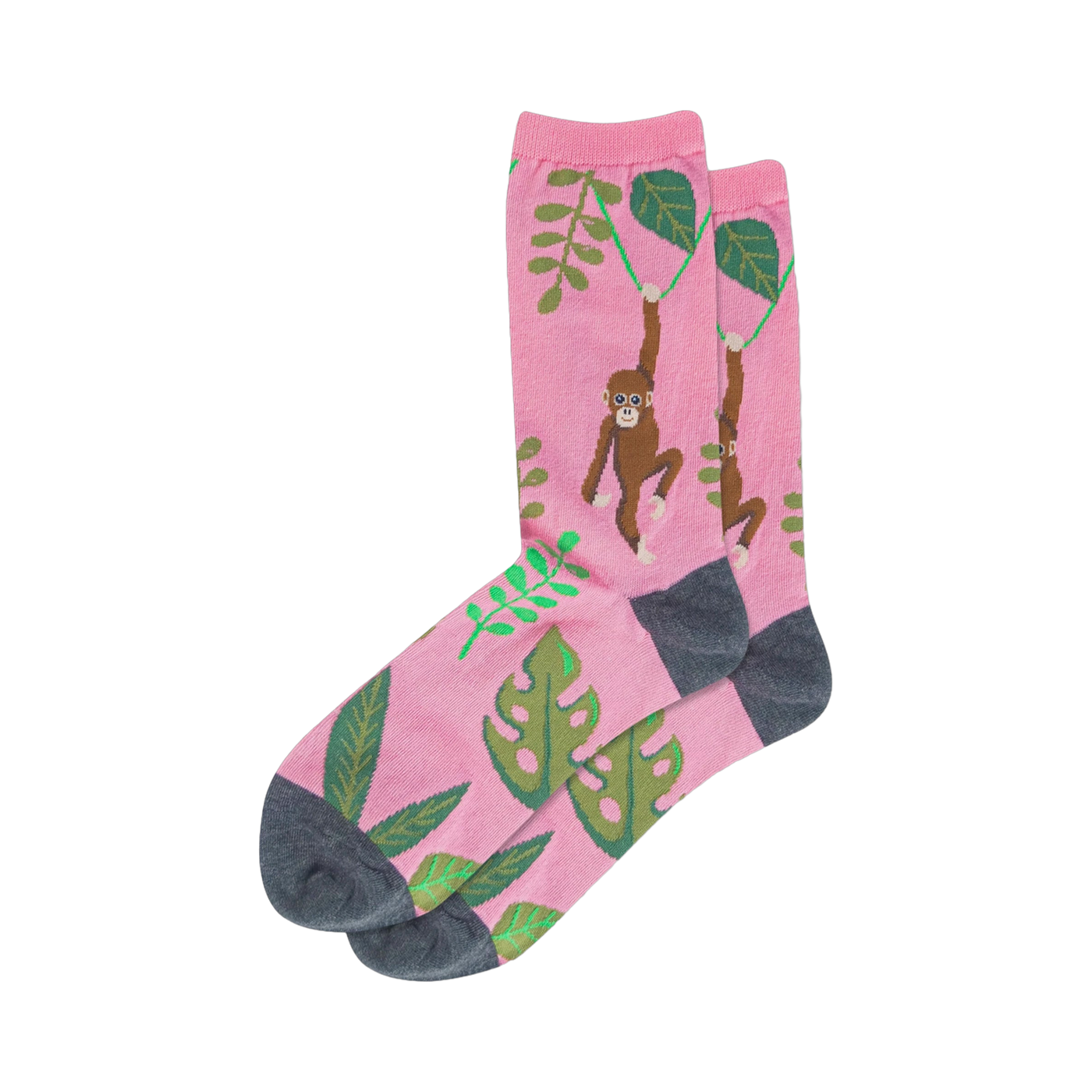 Crew socks, pink base with brown monkeys swinging from vines and green tropical leaves, dark grey heel and toe.