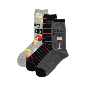 Three crew socks: one grey with cheese illustrations and 'Say Cheese', one black with colorful stripes, and one grey with a wine glass and 'Wine not?'