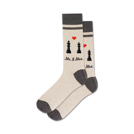 light gray socks with black and red accents feature a pattern of chess pieces, hearts, and stripes, plus the words "mr." and "mrs."   