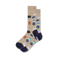 Tan crew socks with navy blue accents. Design includes illustrations of suitcases, headphones, sleep masks, and passports.