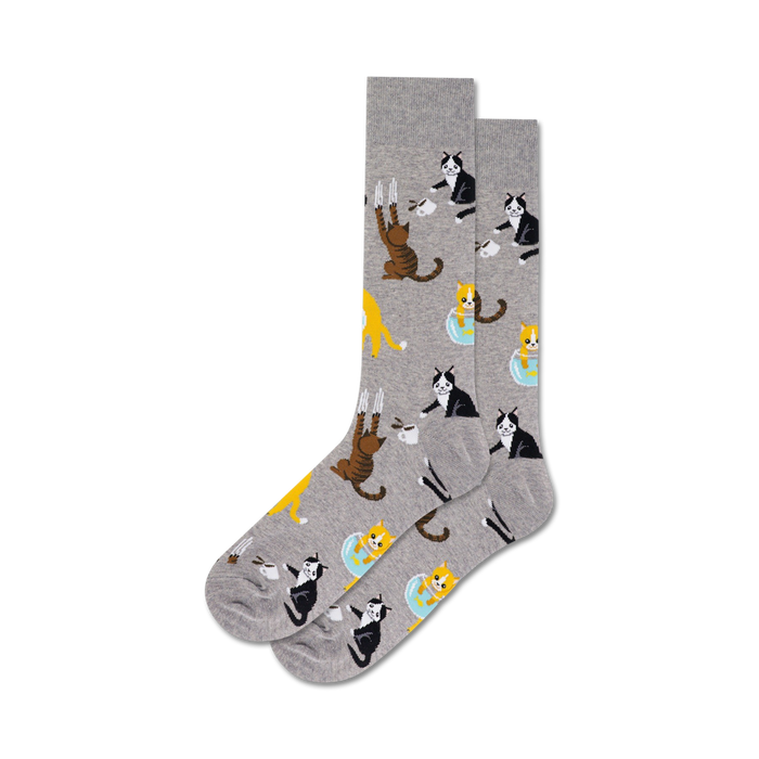 mens crew socks feature gray design with cartoon cats doing funny things like climbing, fishbowling & coffee drinking.   