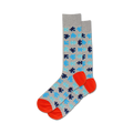 A pair of crew socks in grey, blue, and orange. The socks are covered in a pattern of puzzle pieces.