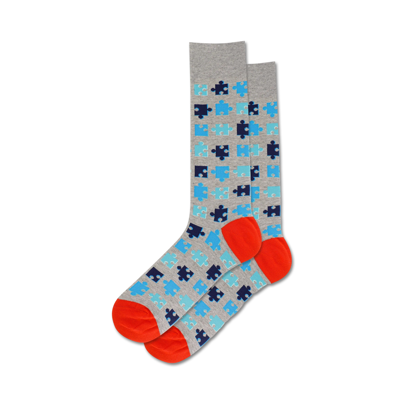 A pair of crew socks in grey, blue, and orange. The socks are covered in a pattern of puzzle pieces.