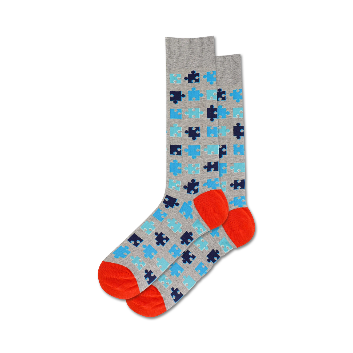A pair of crew socks in grey, blue, and orange. The socks are covered in a pattern of puzzle pieces.