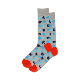 puzzle socks with light gray background, blue and orange puzzle pattern, orange toe and heel, crew length for men.   