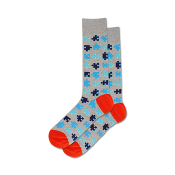 puzzle socks with light gray background, blue and orange puzzle pattern, orange toe and heel, crew length for men.   