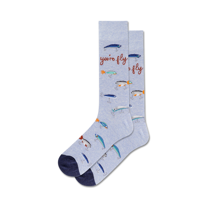 light blue crew socks with a pattern of fishing lures and fish. fly themed novelty socks for men. fun socks perfect for fishing enthusiasts.  