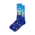 Pair of crew socks in blue with yellow stars. The top features a design of three pelicans on posts in the water under a light blue sky.