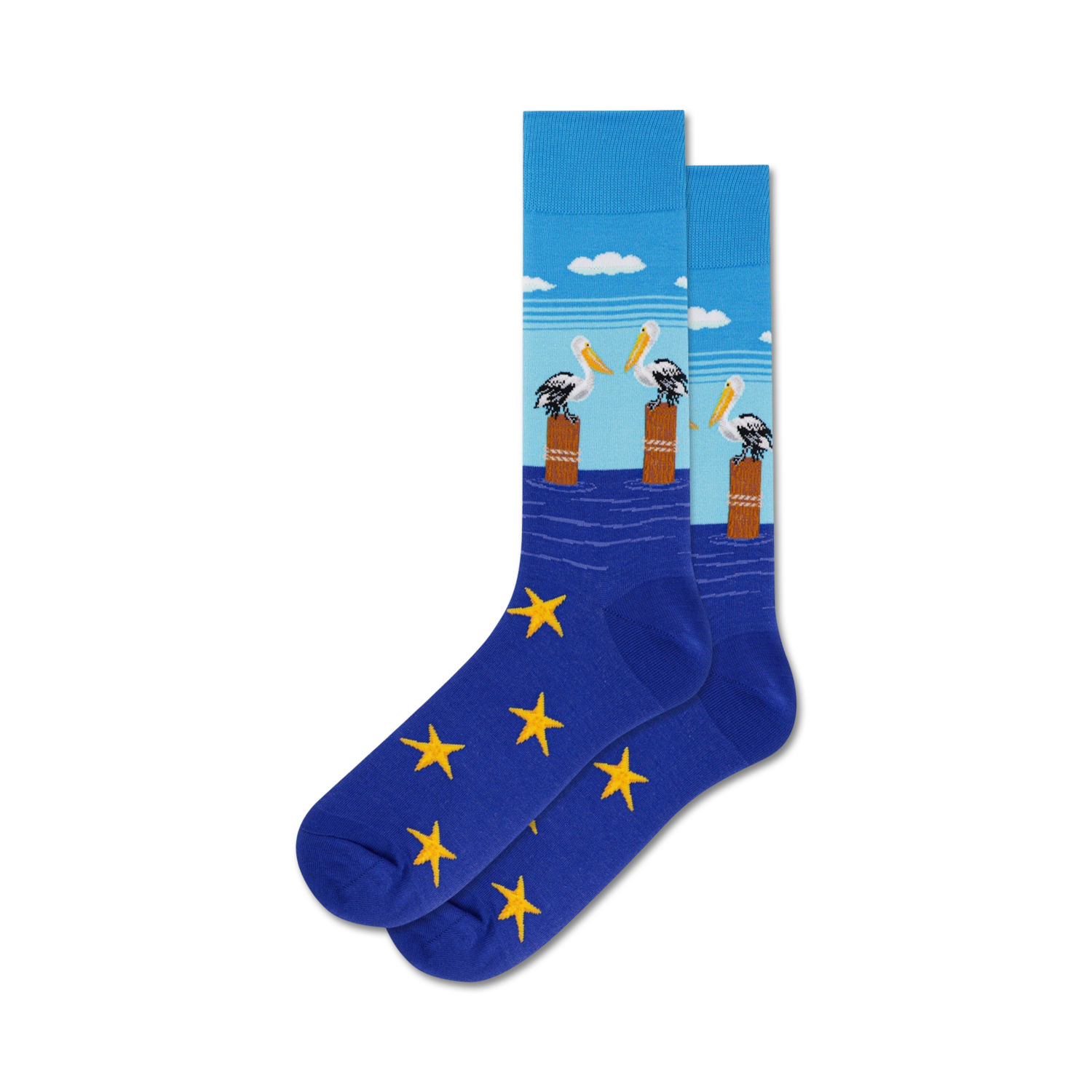 Pair of crew socks in blue with yellow stars. The top features a design of three pelicans on posts in the water under a light blue sky.