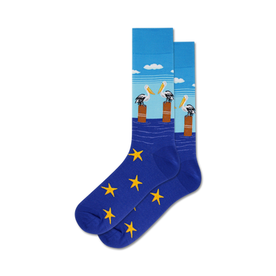 blue crew socks with a pattern of brown posts, pelicans, and yellow starfish. men's pelican socks   