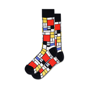 geometric mondrian-inspired red, blue, yellow, and black blocks on white background. crew socks for men.  