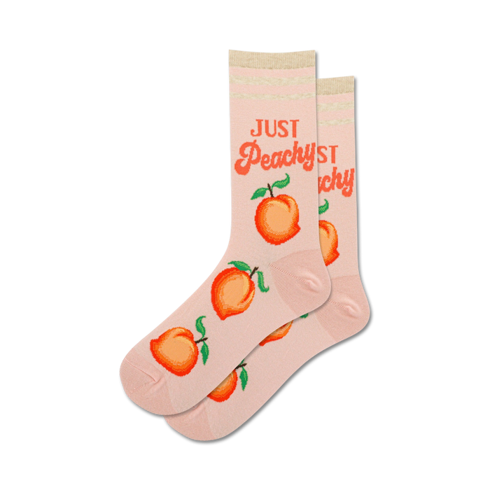 crew length pink just peachy socks feature a cheerful pattern of peaches with green leaves.   }}