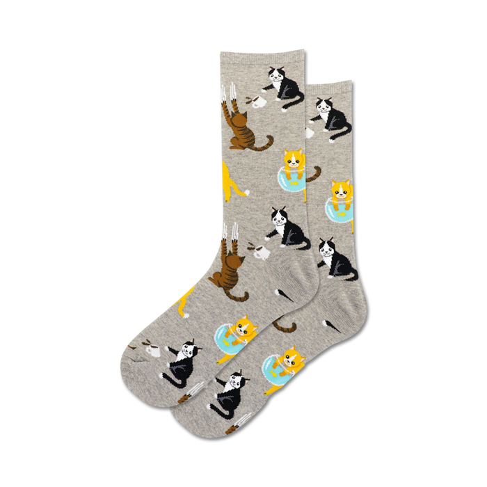 gray crew socks showcasing black, white, orange, and tabby cats doing mischevious things such as scratching, knocking over mugs, and reaching for fish in a bowl