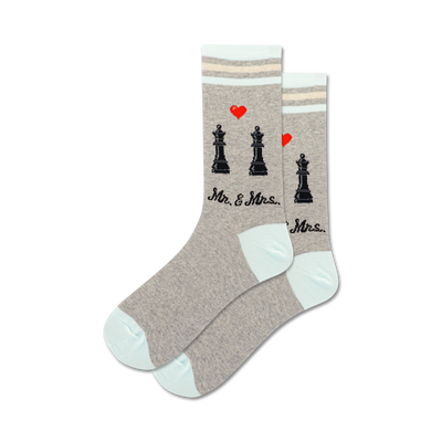 here is a matter of fact alt text description of the product:  "gray crew socks with a black king and queen chess piece pattern, red hearts above each piece, and the words "mr. & mrs." for women."   