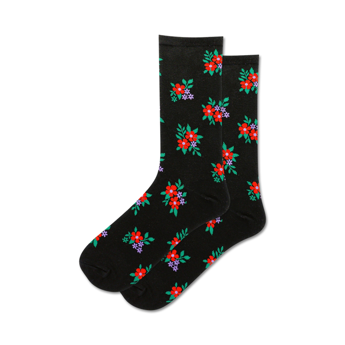 black crew socks adorned with a pattern of red, purple flowers and green leaves. floral themed.  