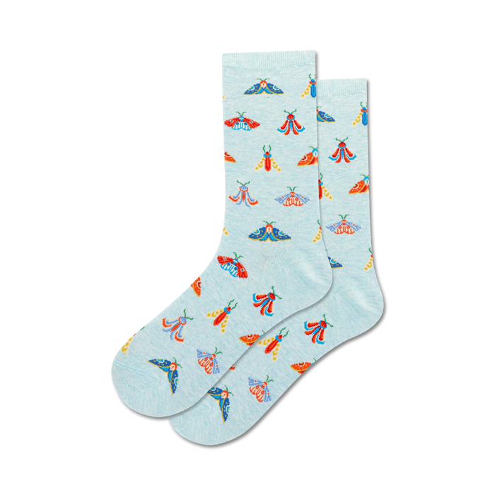 women's crew-length socks with repeated moth design on light blue background.  