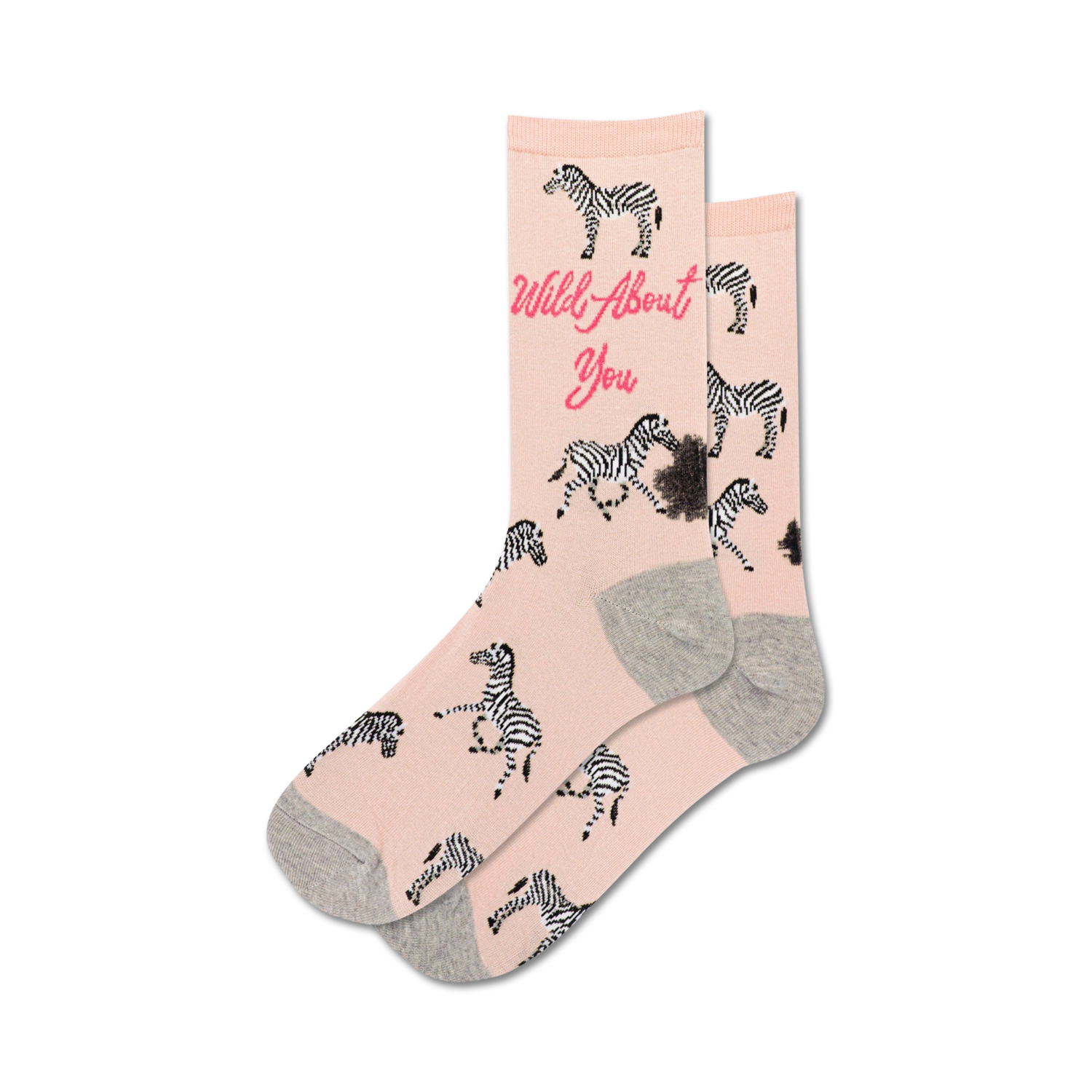 Pair of blush pink crew socks with black and white zebras and the text 'Wild About You'.