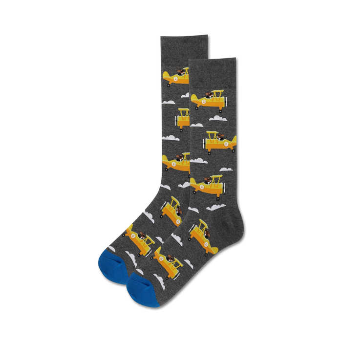 gray crew socks for men featuring yellow airplanes with brown and white details, blue toes, and white clouds.  
