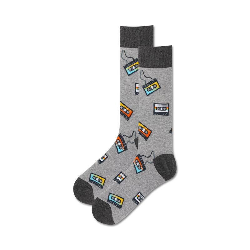 Pair of crew socks in gray with a repeating pattern of colorful cassette tapes. 