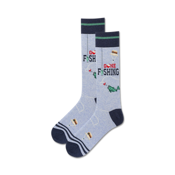 crew socks with dark blue toes, heels, and tops and a green stripe, that have the words 'gone fishing' on them with a fishhook and worm above the words. the left sock has a fish wearing a hat and the right sock has a hotdog wearing a hat.    