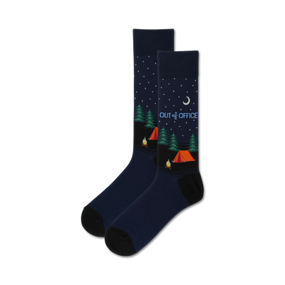 dark blue men's crew socks with a camping theme, white crescent moon, stars, pine trees, tent and campfire. "out of office" is written on the socks.  