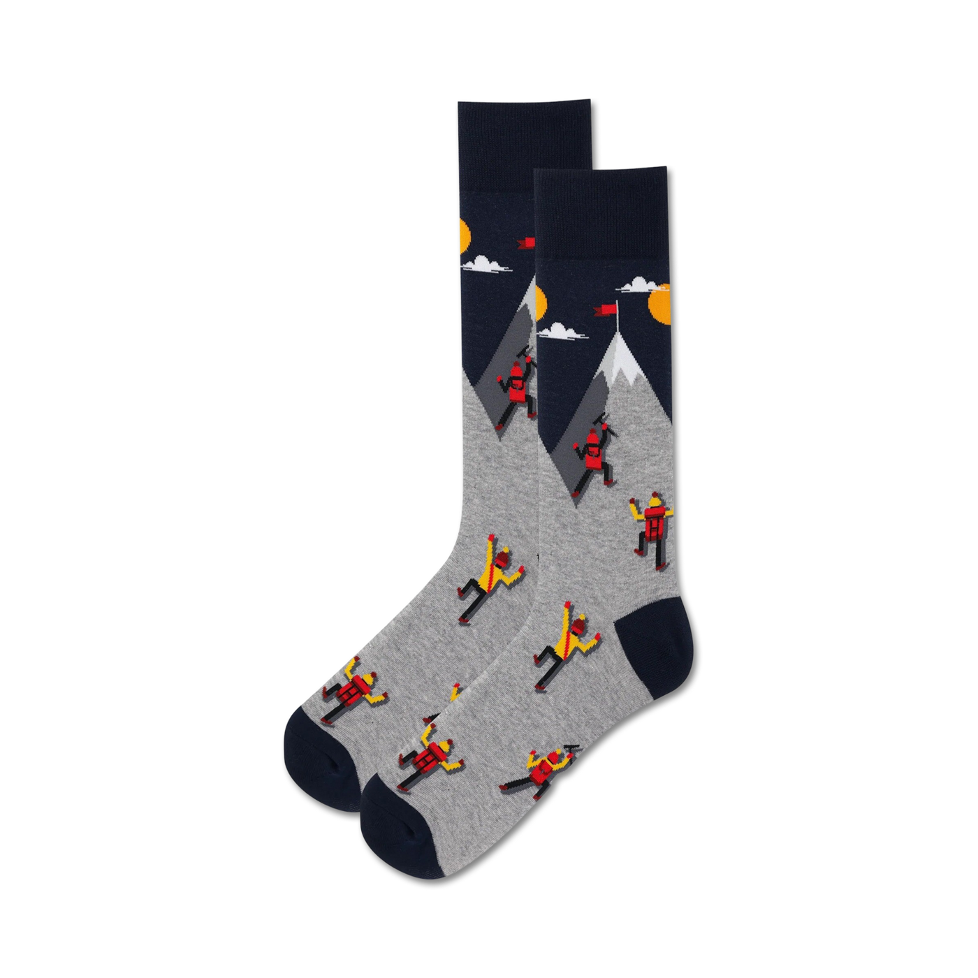 Pair of grey and navy crew socks. Design features cartoon climbers ascending a mountain with a yellow sun and clouds.