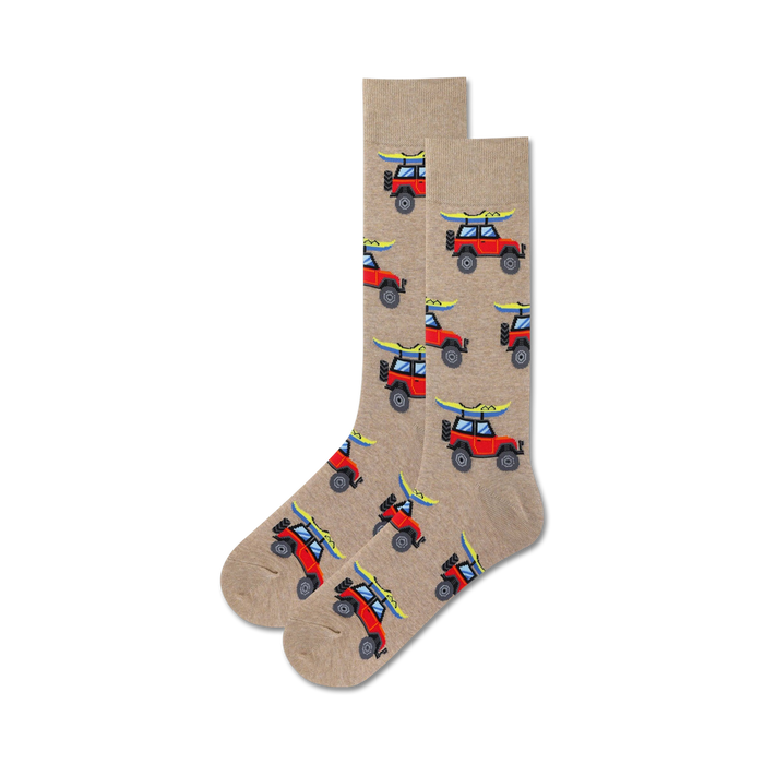 mens crew length socks with a red off-road vehicle and yellow surfboard pattern on a light brown background.   