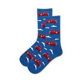 blue women's crew sock with white puffy cloud background and playful dog flying propeller plane.  