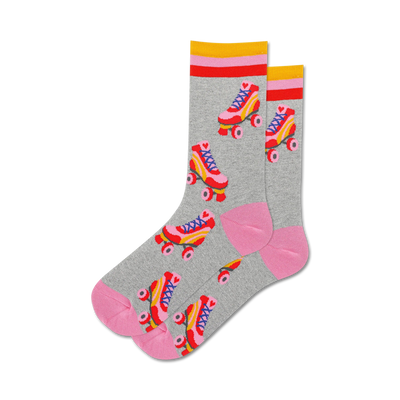 gray crew socks with pink and blue roller skates. pink top with two yellow and one red stripe. pink bottom.  