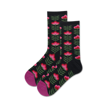 black crew socks for women, featuring a colorful retro floral pattern of hot pink flowers, dark green stems and leaves.  