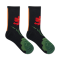 Pair of black crew socks.  Features a red lotus flower and green leaves.  Orange stripe detail at the top.