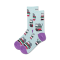 Pair of crew socks; light blue background, purple heel and toe; grey cat sitting on a stack of colorful books.