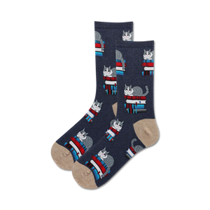 cartoon cat crew socks with glasses perched on stacks of books. blue with brown toes and heels.  