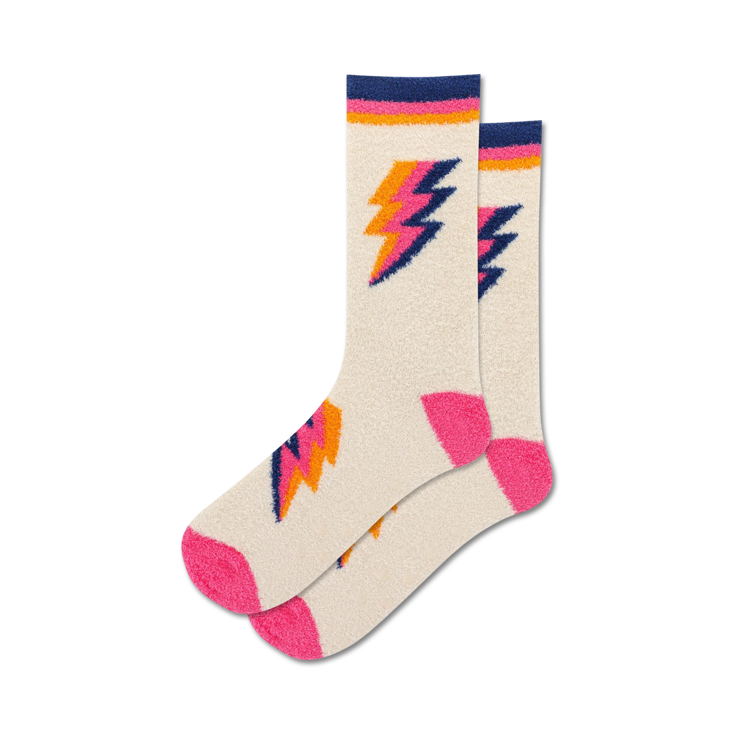 Pair of cream fuzzy crew socks with pink and orange lightning bolt designs. Non-skid grips on the sole.