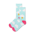 Lifestyle product shot: A person's feet wearing the light blue Clouds Non-Skid socks with pink accents on a light wooden floor.