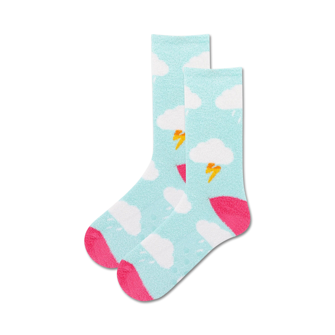 Lifestyle product shot: A person's feet wearing the light blue Clouds Non-Skid socks with pink accents on a light wooden floor.