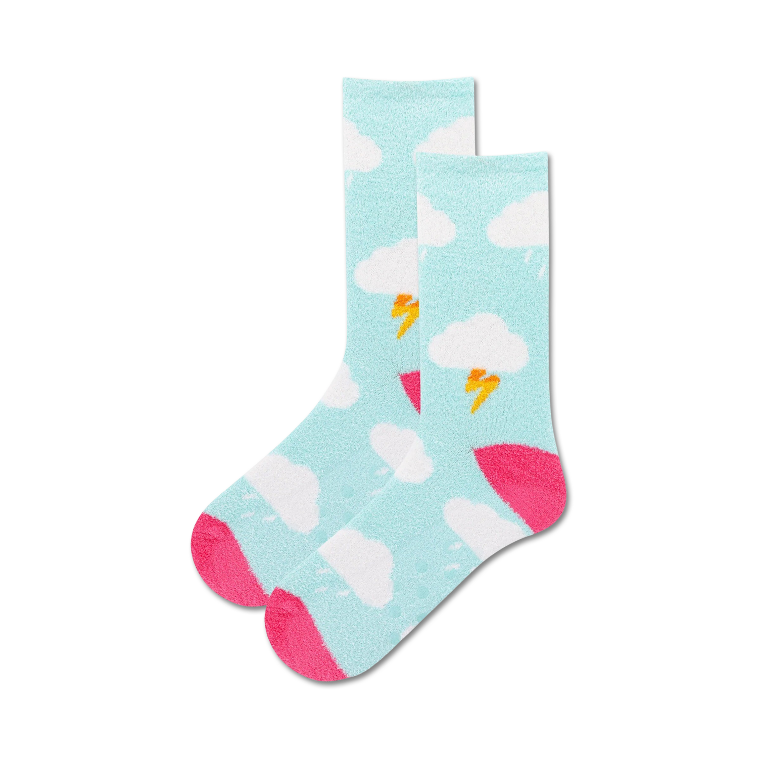 Lifestyle product shot: A person's feet wearing the light blue Clouds Non-Skid socks with pink accents on a light wooden floor.