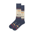 Pair of crew socks in navy blue, beige, and red.  They feature a whimsical corkscrew design and the phrase 'Screw It'.