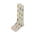 Pair of beige crew socks with a repeating pattern of potted plants in shades of green and brown.