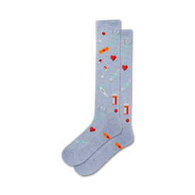 light blue womens crew socks with pattern of medical icons: hearts, pills, thermometers, stethoscopes, bandages.  