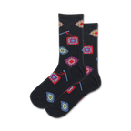 Pair of black crew socks adorned with colorful granny square and knitting needle designs.