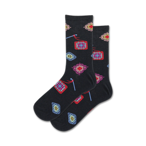 granny square crew socks: black socks with granny square patterns featuring colorful yarns and various designs.   