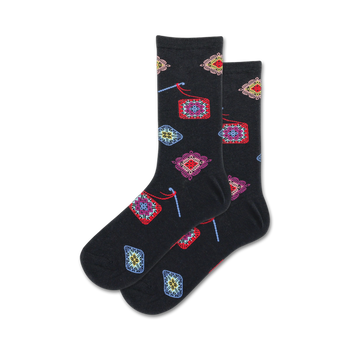 granny square crew socks: black socks with granny square patterns featuring colorful yarns and various designs.   