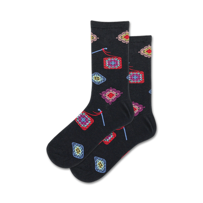 granny square crew socks: black socks with granny square patterns featuring colorful yarns and various designs.   