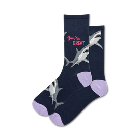 dark blue crew socks for women with cartoon sharks wearing party hats and the text '{you're great}'. purple toes and heels.   