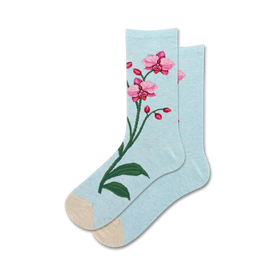 light blue crew socks for women feature a pattern of pink orchids with green leaves and yellow centers, ribbed cuff, reinforced toe, and heel.  
