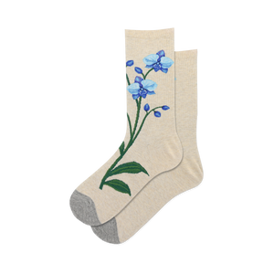 Pair of women's crew socks in beige featuring embroidered blue orchids. Grey heel and toe.