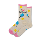 Pair of crew socks in beige and pink.  The socks feature 'I love Pickleball' text and illustrations of pickleball paddles and balls.